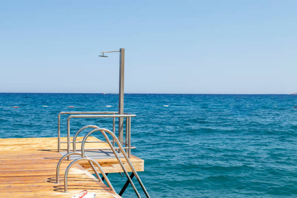 istock sunbathing pier and shower, holiday 1413786168