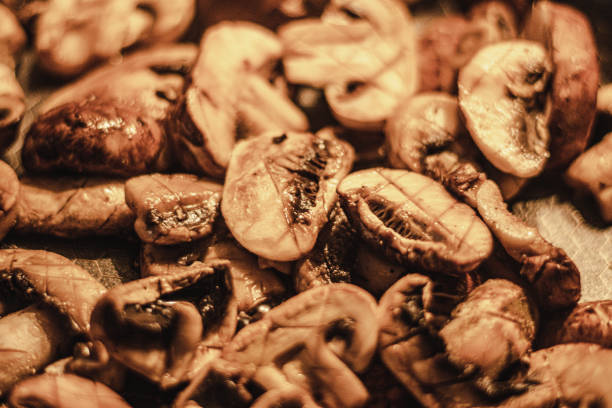 fried mushrooms in a pan, close up, Food background