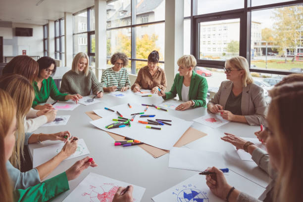 istock Businesswoman talking with team during activity 1413787971