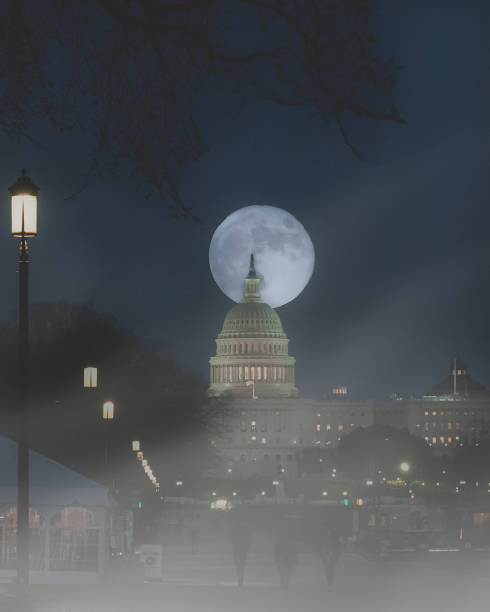 istock Moonrise behind the U.S Capitol Building 1413788809