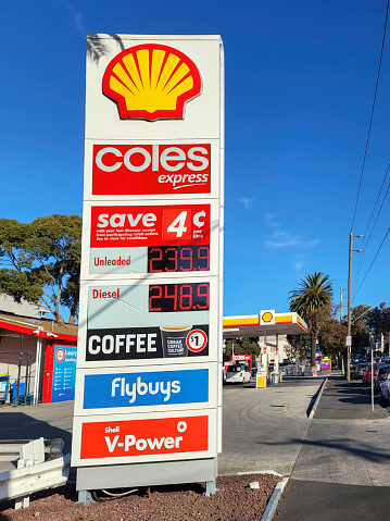 St Kilda, Melbourne, Australia: July 05, 2022: Expensive prices for fuel at a Shell petrol station due to ongoing differculties with fuel shortages. Coles Express store attached to location.
