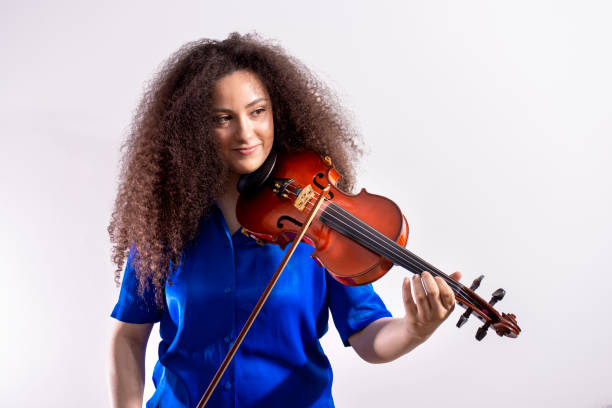 istock Girl afro violinist on white background with copy space 1413788879