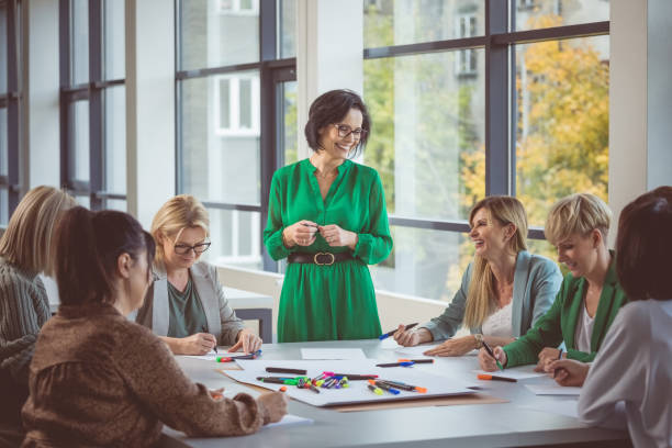 istock Colleagues discussing with each other during meeting 1413789149