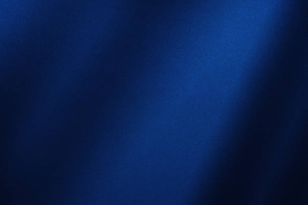 Abstract dark blue background. Silk satin. Navy blue color. Elegant background. Abstract dark blue background. Silk satin. Navy blue color. Elegant background with space for design. Soft wavy folds. textile industry stock pictures, royalty-free photos & images