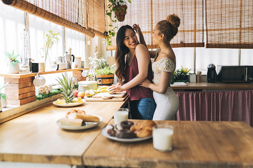 women lesbians cooking breakfast lgbt multiracial