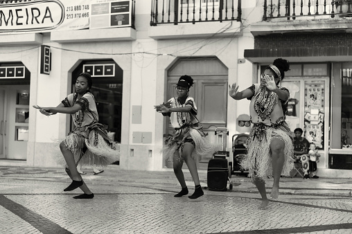 Lisbon, Portugal - July 2, 2022: A group african dancers perform at the Rua Augusta street in Lisbon downtown.