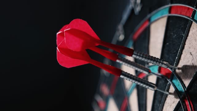 throwing dart arrows in the dartboard. target marketing concept
