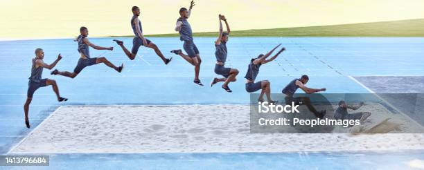 A Sequence Of A Fit Male Athlete Jumping In A Sandpit Competing In The Long Jump Professional Athlete Or Track Racer During Long Or Triple Jump Attempt Is A Competitive Sports Event Or Training Stock Photo - Download Image Now