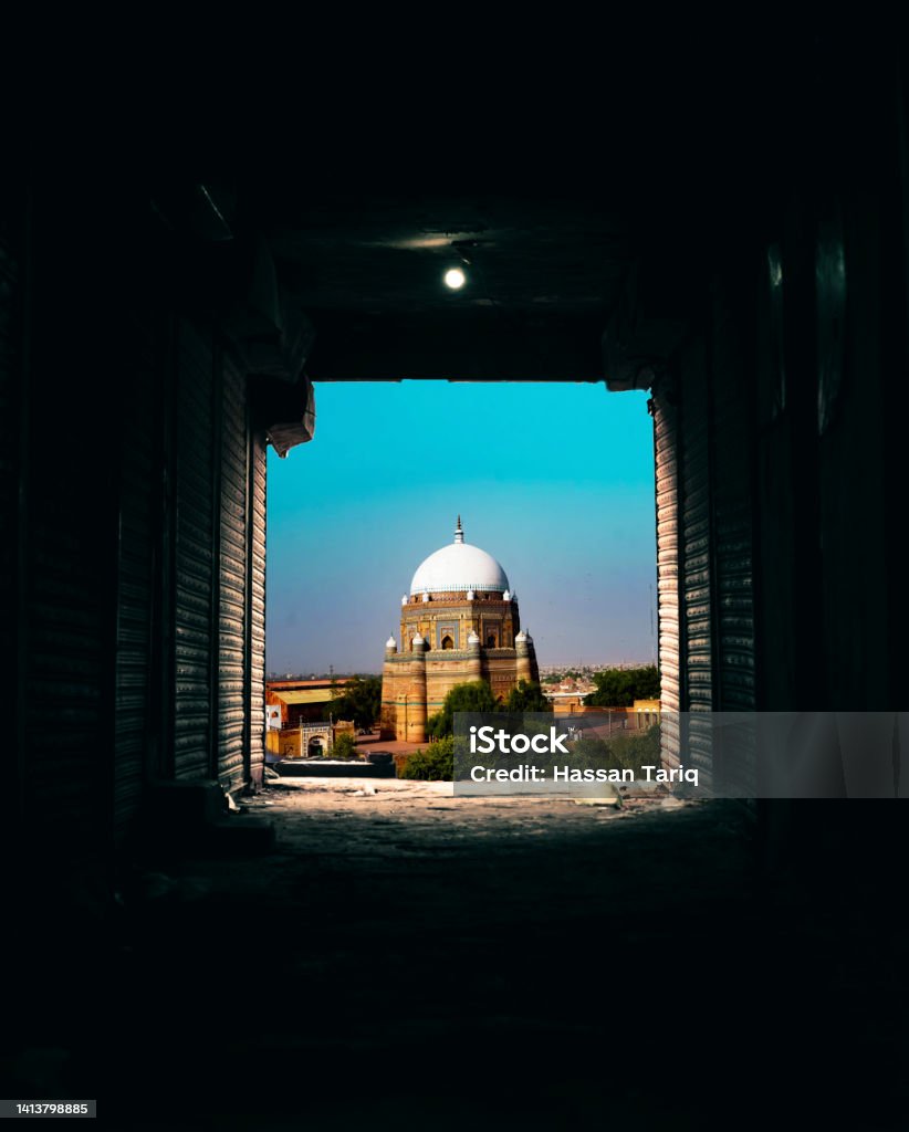 Hazrat shah rukn e alam tomb The Tomb of Shah Rukn-e-Alam located in Multan,Pakistan, is the mausleom of the sufi saint Sheikh Rukn-ud-Din Abul Fateh. The shrine is considered to be the earliest example of tughluq architecture, and is one of the most impressive shrines in the Indian subcontinent. The shrine attracts over 100,000 pilgrims to the annual urs festival that commemorates his death. Ancient Stock Photo