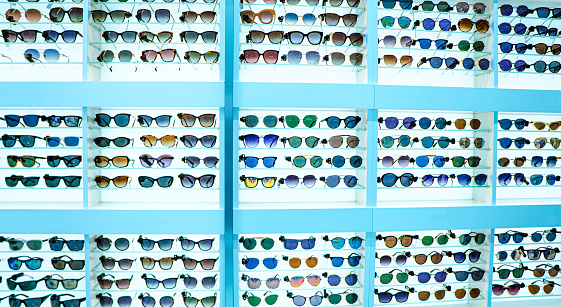 Glasses arranged in different categories on shelves