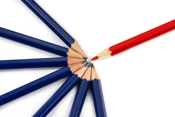 istock Red pencil with some dark pencils. 1413800333
