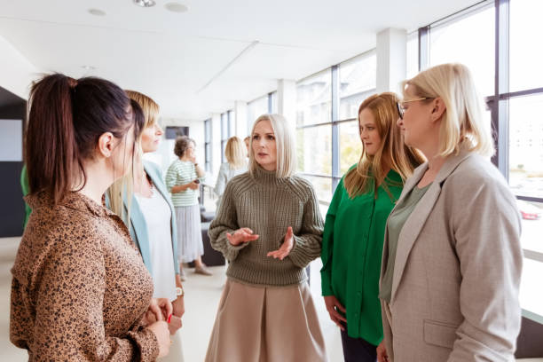 istock Female colleagues listening to manager 1413800377