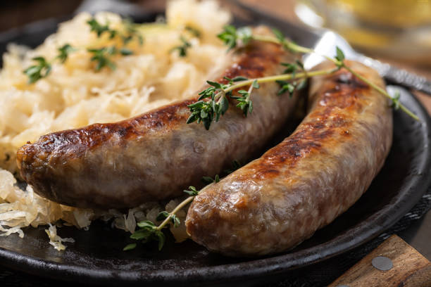 istock Bratwurst dinner with sauerkraut garnished with thyme 1413800726