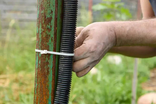 Cable tie for mounting corrugated innerduct conduit. Indoor conduit is designed to be installed inside buildings to facilitate pulling cable between two points.