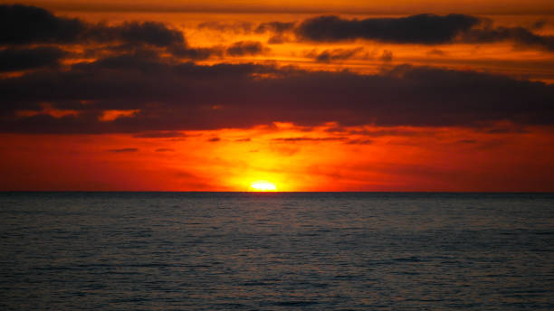 istock Sunset looking like a fire on the ocean 1413805504