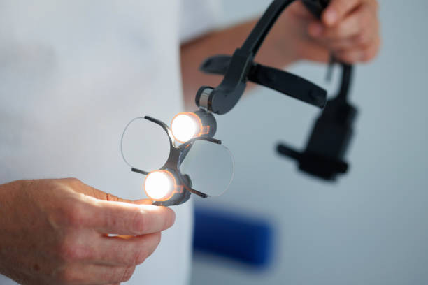 istock Dentist doctor holding the binocular loupes 1413807222