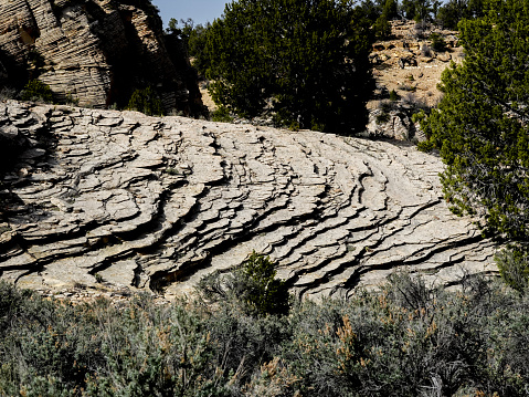 Eroding distinct layers of sandstone.