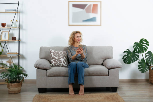 istock Blonde woman at home. 1413814484