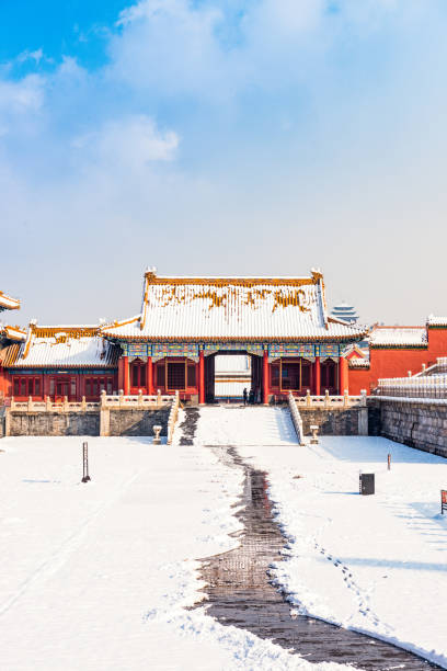 Snow during early springtime in Beijing's Forbidden City, with a footpath cleared for visitors.