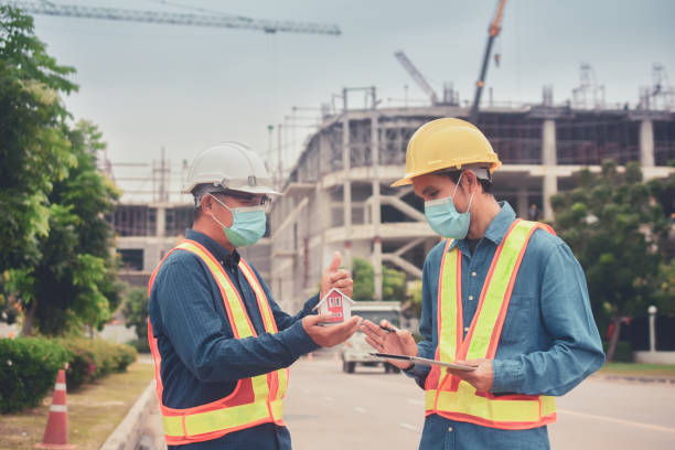 istock Team Asian man architect on a building construction site 1413817125