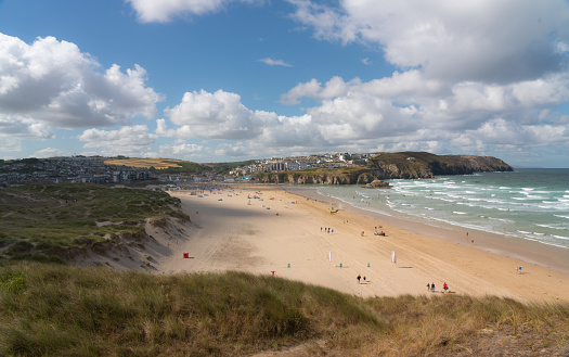 The sun shines down on sandy Perranporth Beach in Cornwall.