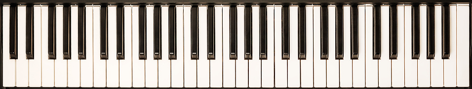 piano keys of an old used piano