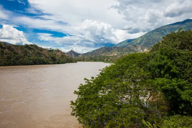 View of the Cauca River from the historical Bridge of the West a a suspension bridge declared Colombian National Monument built in 1887