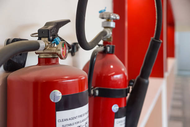 istock Fire extinguisher and gas pump system on the wall. Powerful emergency fire extinguisher equipment. Fire retardant. Fireproof. 1413821189