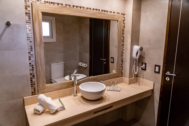 istock bathroom with sink, mirror and tiles 1413821366