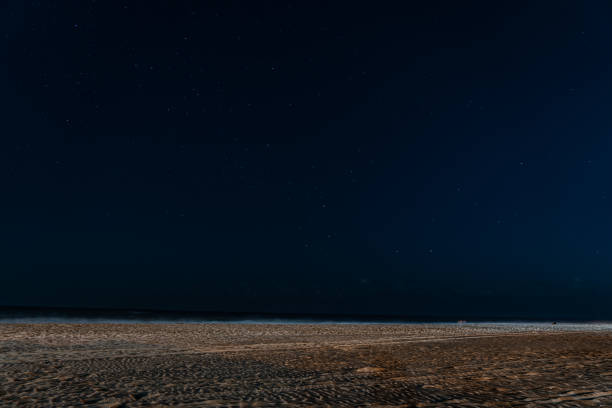 istock starry sky sand and sea 1413821529