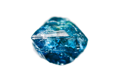 Rare rough uncut blue diamond crystal on white background