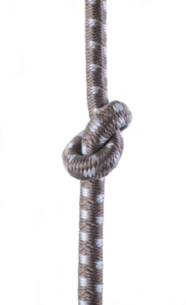istock Colored ropes tied in a knot on a black background 1413821985