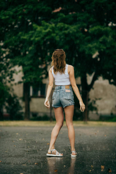 istock Young woman on steps in rain, 1413823046