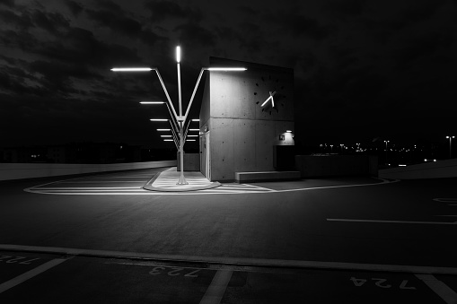 On a cloudy morning this beautiful above-ground parking lot in the early hours