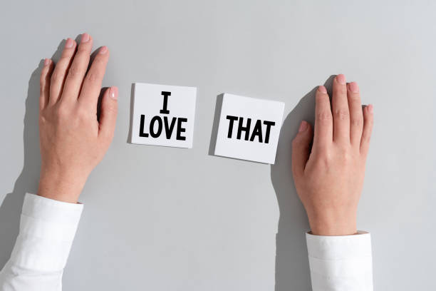istock Sign displaying I Love That. Business showcase Having affection for something or someone Romantic feelings Businesswoman Presenting Different Informations On Two Notes. 1413825313
