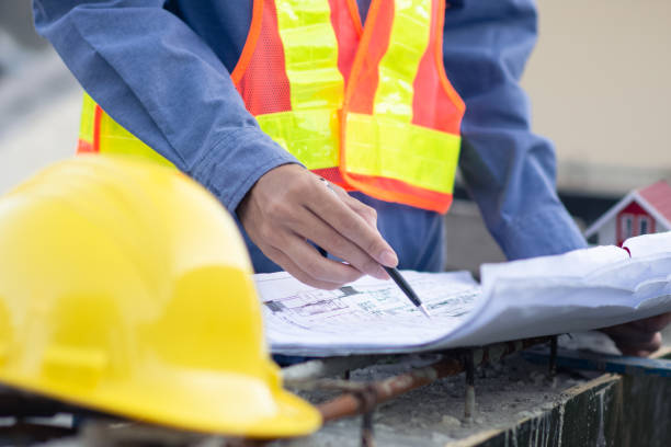 istock Asian Engineer construction are worker employee working by safety control helmet on site building 1413826426
