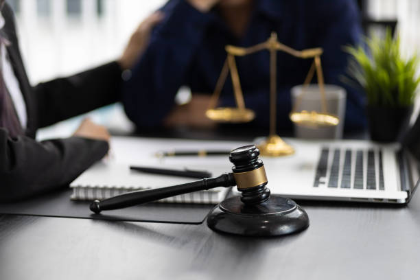 Justice and attorney concept. Lawyer meeting and consoling solution to his client provide legal advice and trust commitment strain serious for problem.