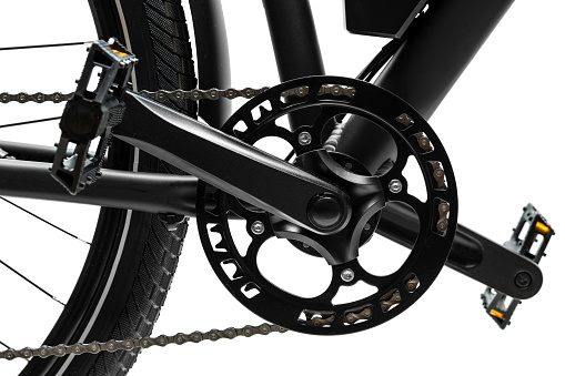 Side view of twisted pedals and chainring of the bicycle on white