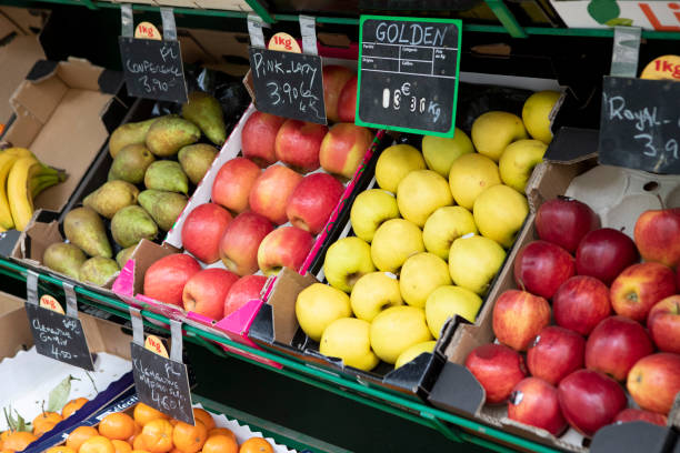 istock Fruit on display in cardboard trays outside a greengrocer's shop 1413829929