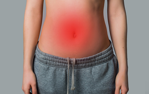 woman's stomach with redness. stomach problems concept