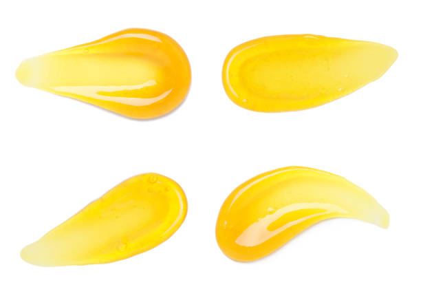 istock Golden honey smear smudges with bubbles set isolated on white 1413832376
