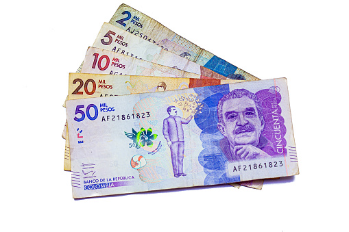 Colombian peso bills of value $2000, $5000, $10000, $20000 and $50000 pesos on white background, August 6, 2022