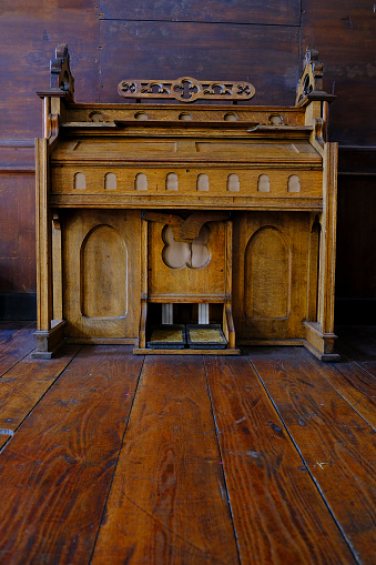 Old chair and modern organ in front of a old tombstone in Sankt Olai Kirke – Saint Olaf’s Church – is a Danish cathedral church in Helsingør also known as Elsinore in English. It has a history going back to around 1200, but the preset building is from 1559.