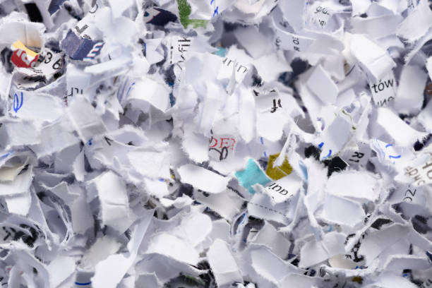 istock Cross cut shredded paper background texture 1413837514