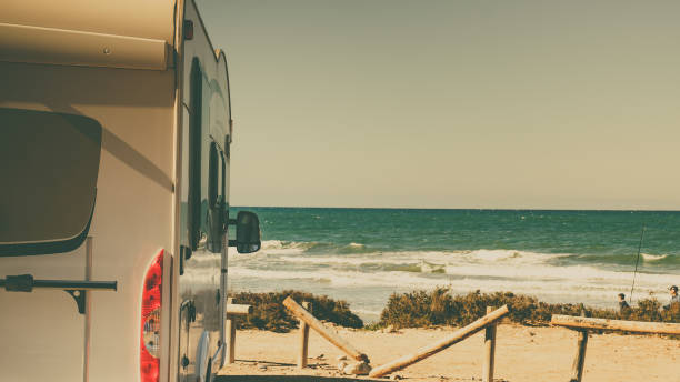 istock Camper car on beach, camping on nature 1413837950