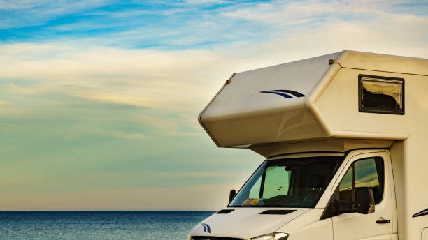 istock Camper car on beach, camping on nature 1413838051