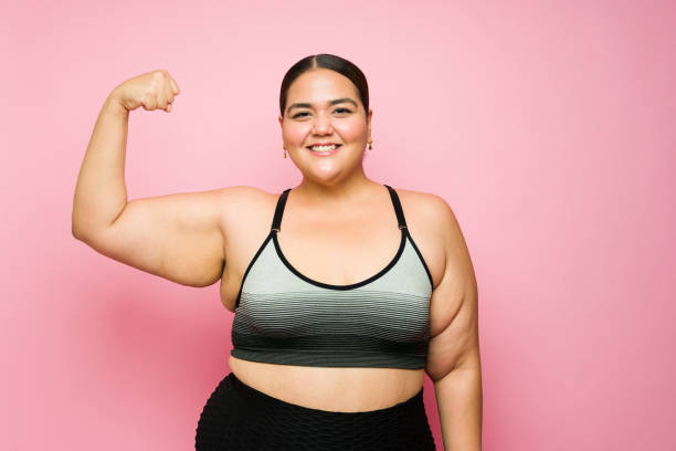 istock Excited strong woman losing weight with workout exercises 1413838163