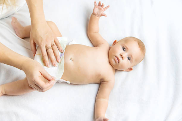 istock High Angle View Of Baby Lying On Bed 1413839440