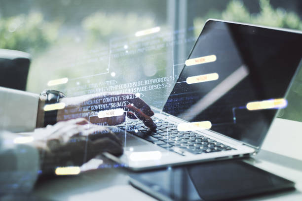 istock Double exposure of abstract creative programming illustration and hands typing on laptop on background, big data and blockchain concept 1413839628