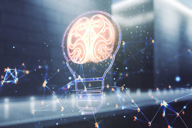 istock Abstract virtual creative light bulb with human brain hologram on contemporary business center exterior background, artificial Intelligence and neural networks concept. Multiexposure 1413839762